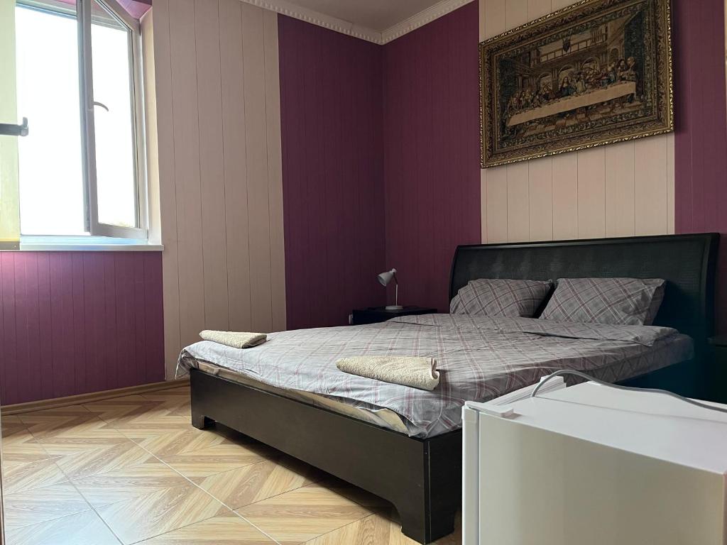 Postel nebo postele na pokoji v ubytování Mini Hotel Leon