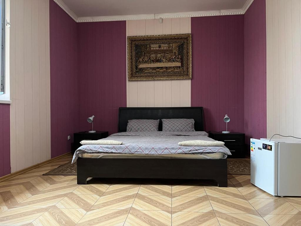 Postel nebo postele na pokoji v ubytování Mini Hotel Leon