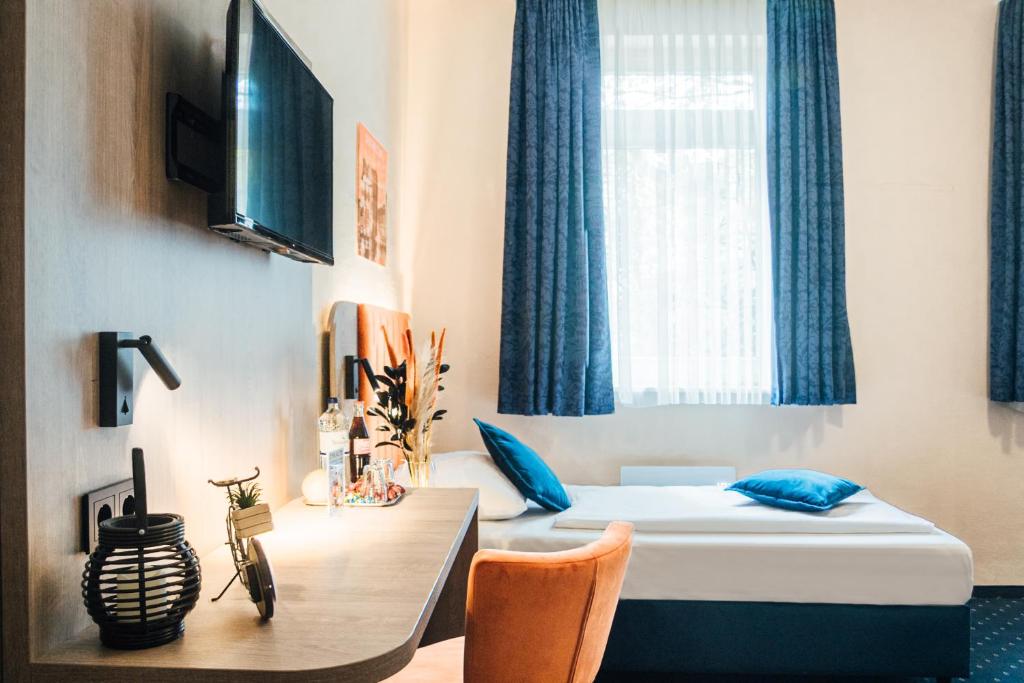 Postel nebo postele na pokoji v ubytování Hotel Commerz Hamburg