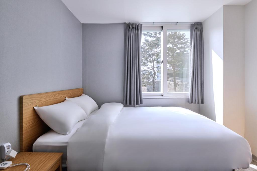 Postel nebo postele na pokoji v ubytování D Stay Hostel Dongdaemun