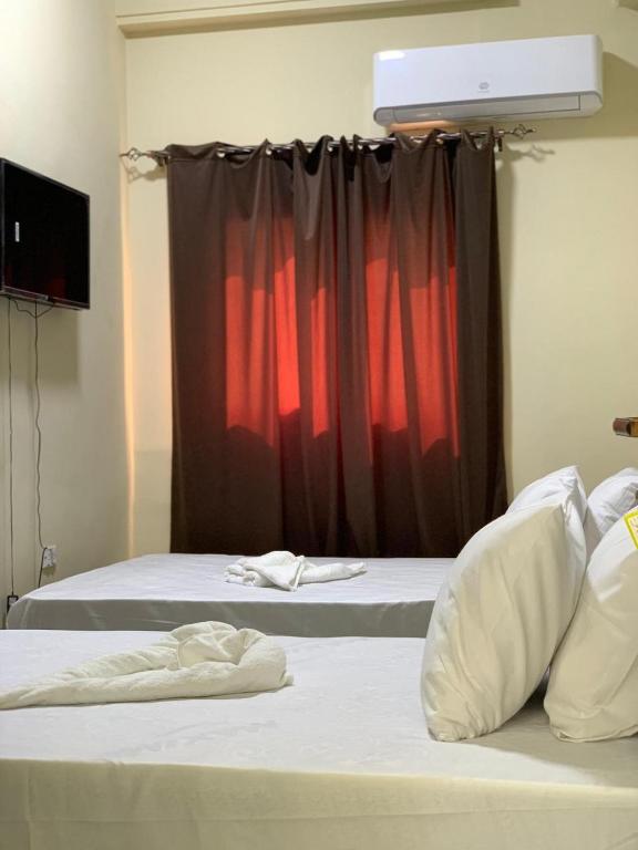 Postel nebo postele na pokoji v ubytování رويال ماجيك