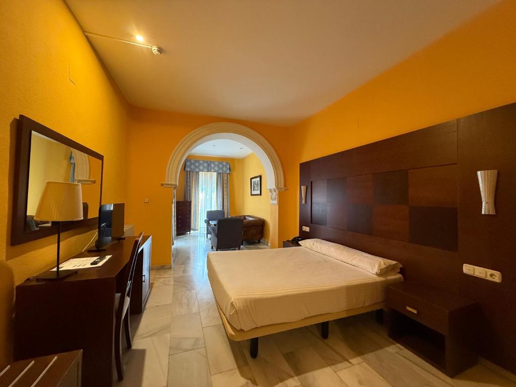 Postel nebo postele na pokoji v ubytování Hotel Nuevo Palas