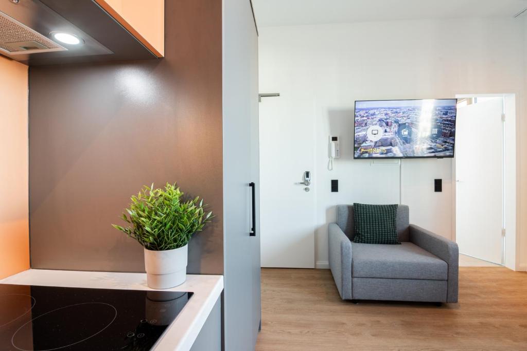 TV a/nebo společenská místnost v ubytování Homaris Apartments Winterhude