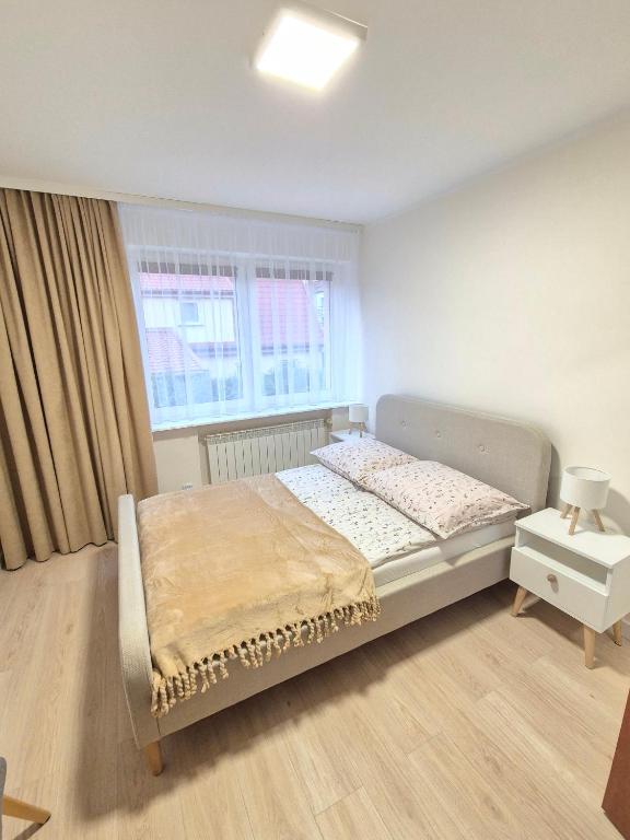 Postel nebo postele na pokoji v ubytování Villa Joanna