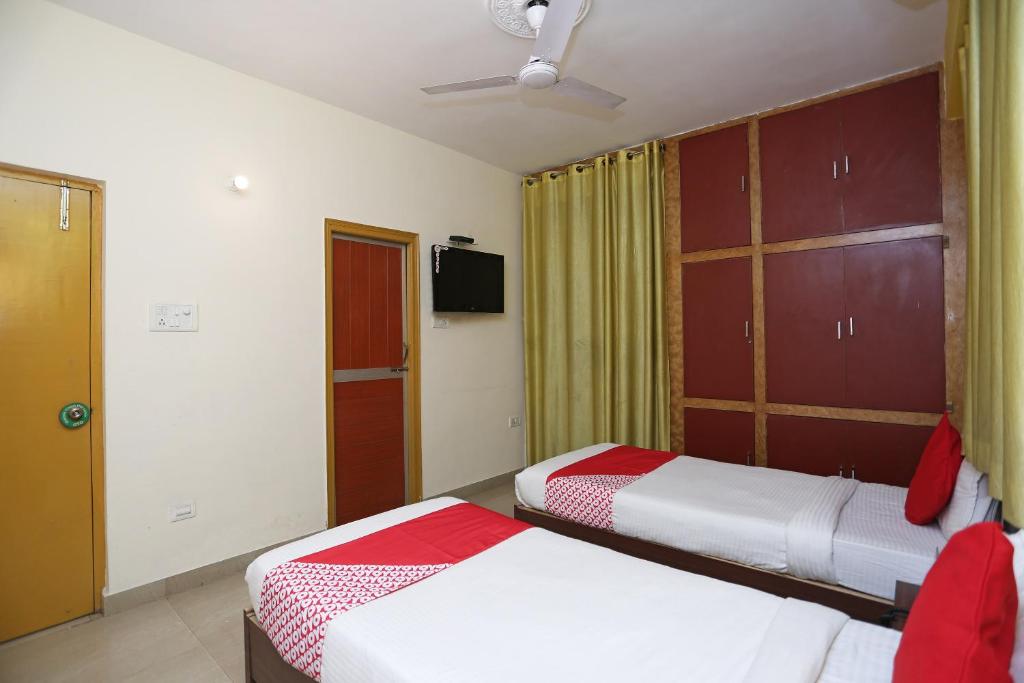 Postel nebo postele na pokoji v ubytování Vibrant Guest House