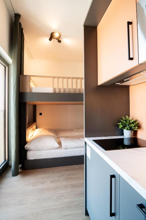 Postel nebo postele na pokoji v ubytování Homaris Apartments Winterhude