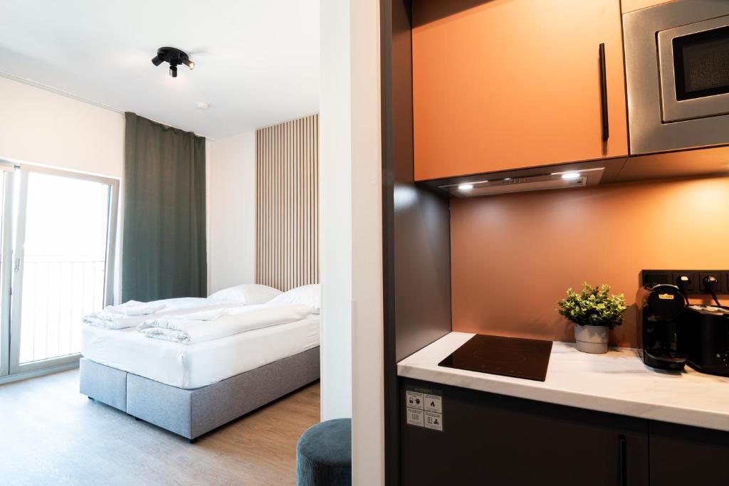 Postel nebo postele na pokoji v ubytování Homaris Apartments Winterhude