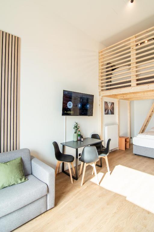 TV a/nebo společenská místnost v ubytování Homaris Apartments Winterhude
