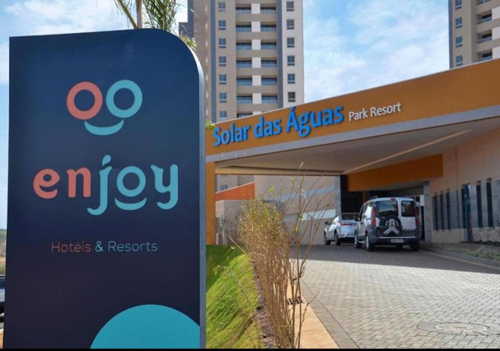 a sign in front of an emy gas station at Apto em Olímpia- Enjoy Solar das Águas Park Resort in Olímpia