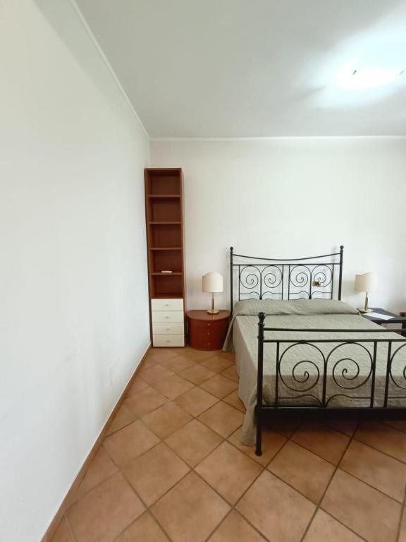 Postel nebo postele na pokoji v ubytování Relais Albalonga