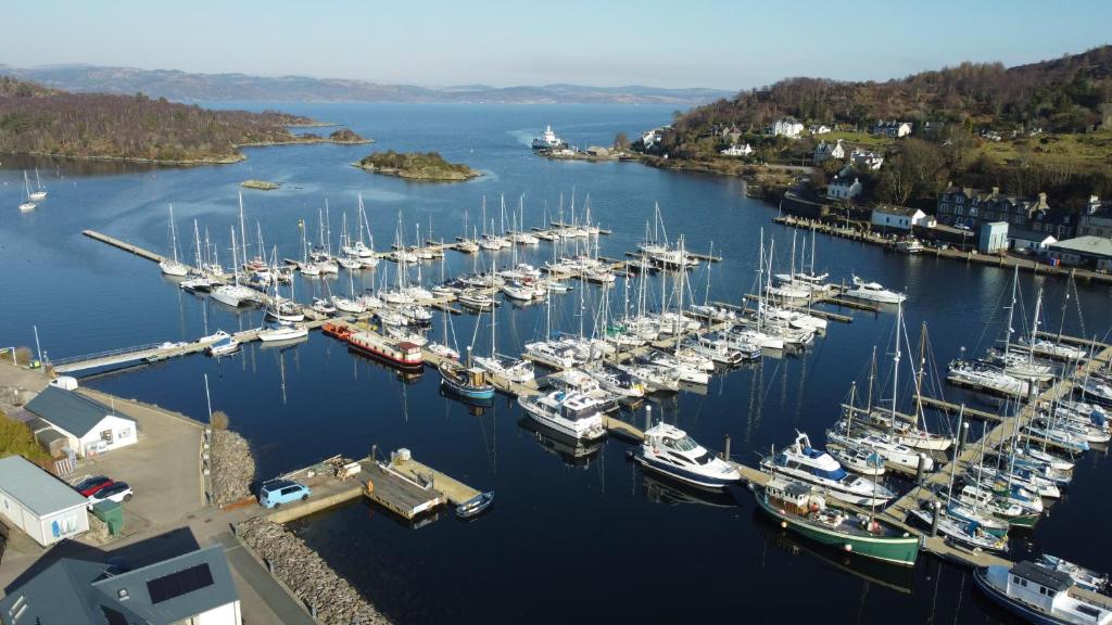 an aerial view of a harbor filled with boats at The waterfront in Tarbert