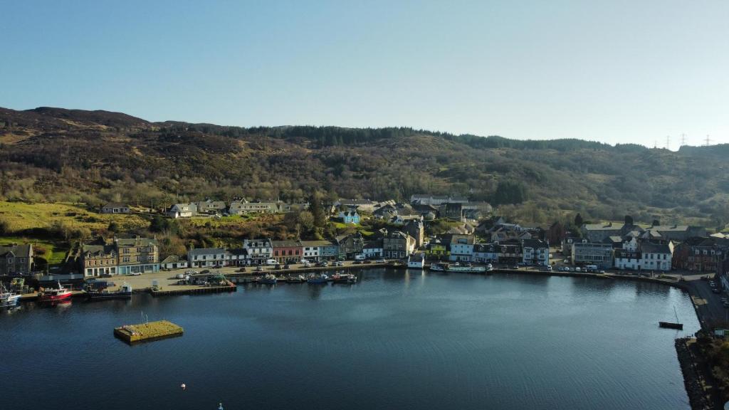 an aerial view of a town on a body of water at The waterfront in Tarbert