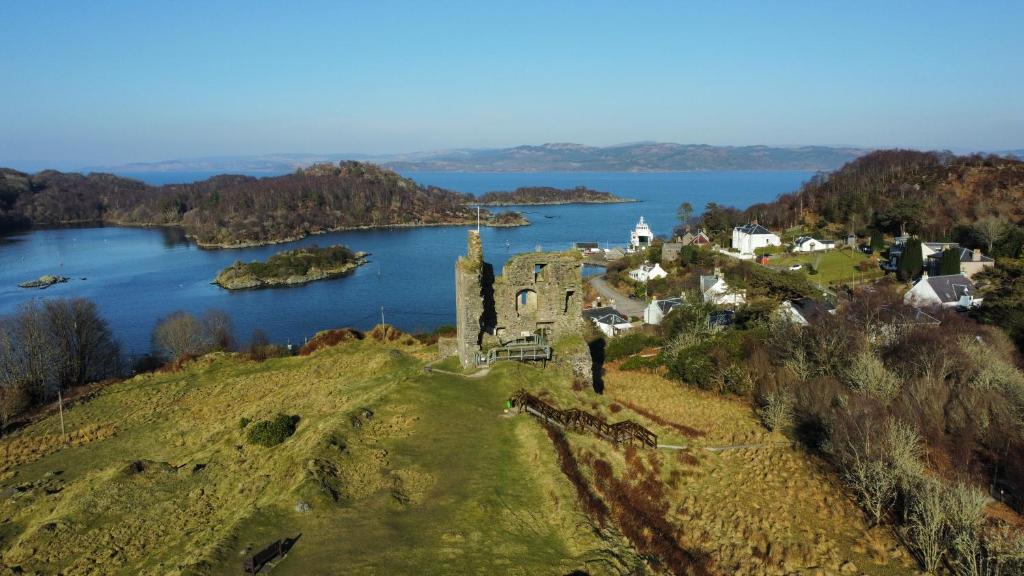 an island in the middle of a body of water at The waterfront in Tarbert