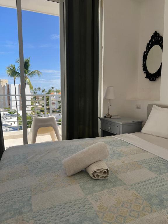 Postel nebo postele na pokoji v ubytování punta Beach sol caribe Los corales ducassi apartment