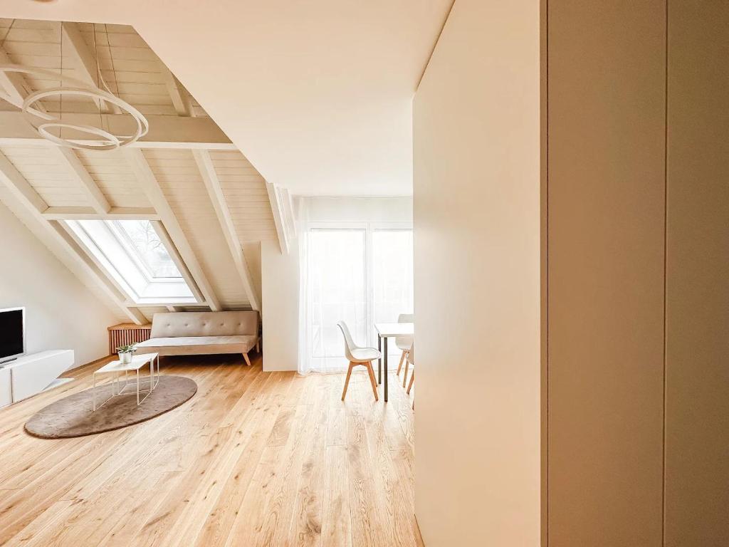 a living room with a table and a couch at VK - H - Zürich Airport - Luxury - Homestay - Haldenstrasse - Kloten in Kloten
