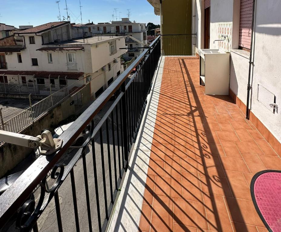 a balcony of a building with a view of a city at Greta Apartment Tropea in Tropea