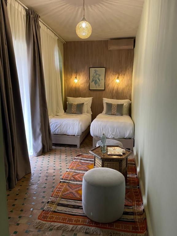 Postel nebo postele na pokoji v ubytování Riad La Calèche & SPA