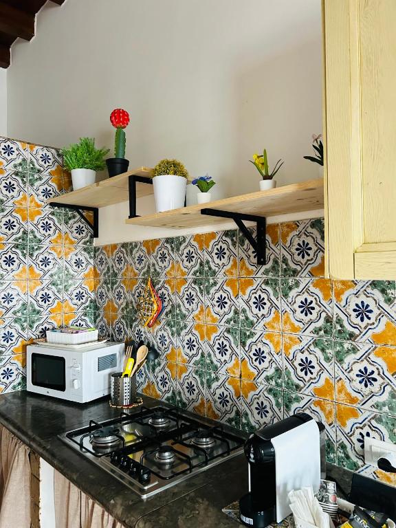 Kuchyňa alebo kuchynka v ubytovaní Sikelia Apartment
