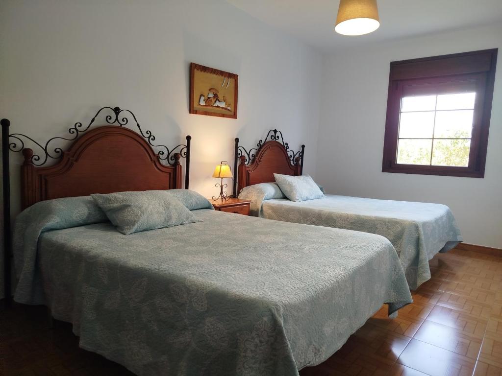 A bed or beds in a room at Apartamentos Rurales Inguanzo