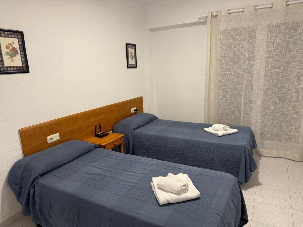 Postel nebo postele na pokoji v ubytování Apartamentos Flandria