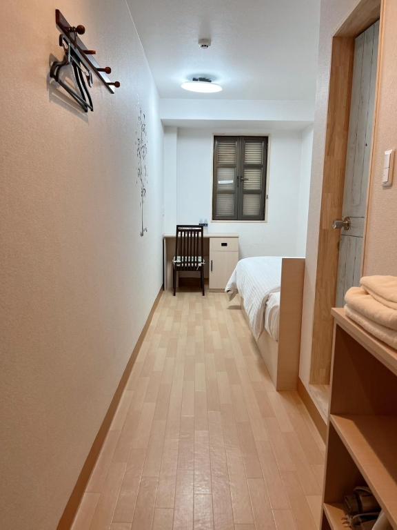 Postel nebo postele na pokoji v ubytování ひまわりHotel