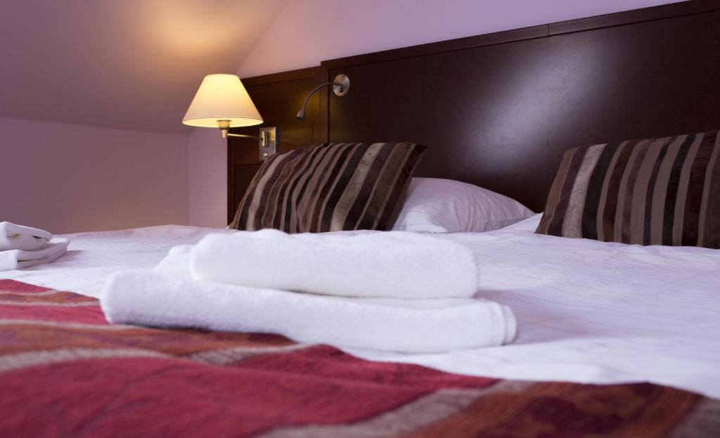 Postel nebo postele na pokoji v ubytování Hotel Atrium
