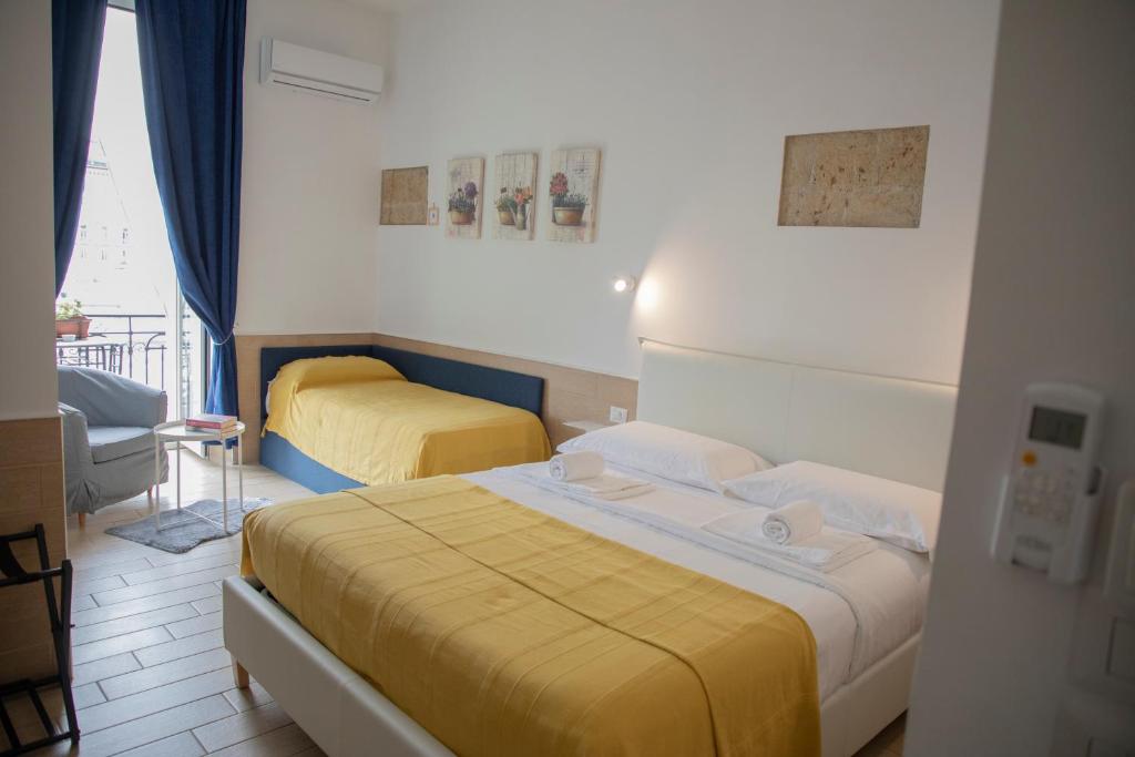 Postel nebo postele na pokoji v ubytování H22 Hotel
