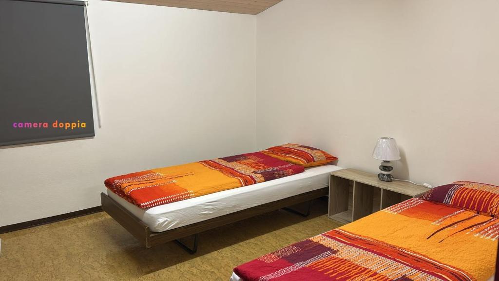 Postel nebo postele na pokoji v ubytování Casa Sant'Angelo