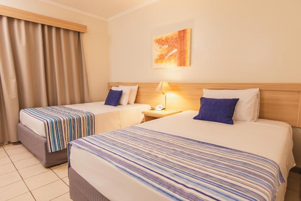 Cama ou camas em um quarto em Hotel Golden Park Ribeirão Preto by Nacional Inn