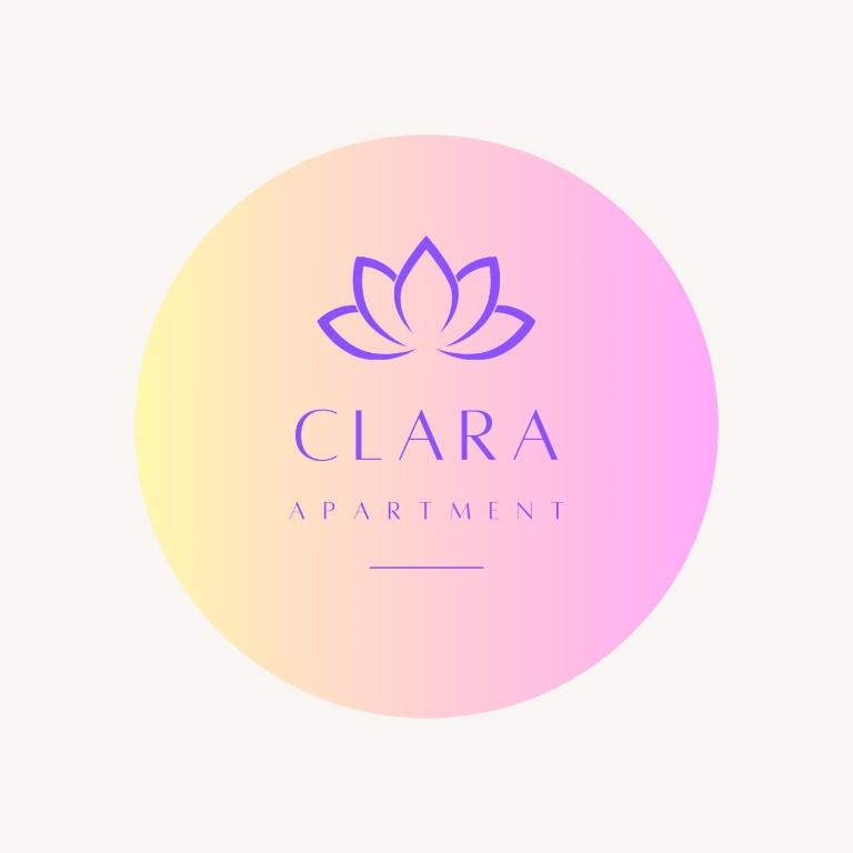 a pink logo for a clinic with a lotus flower at Clara Apartment in Parghelia