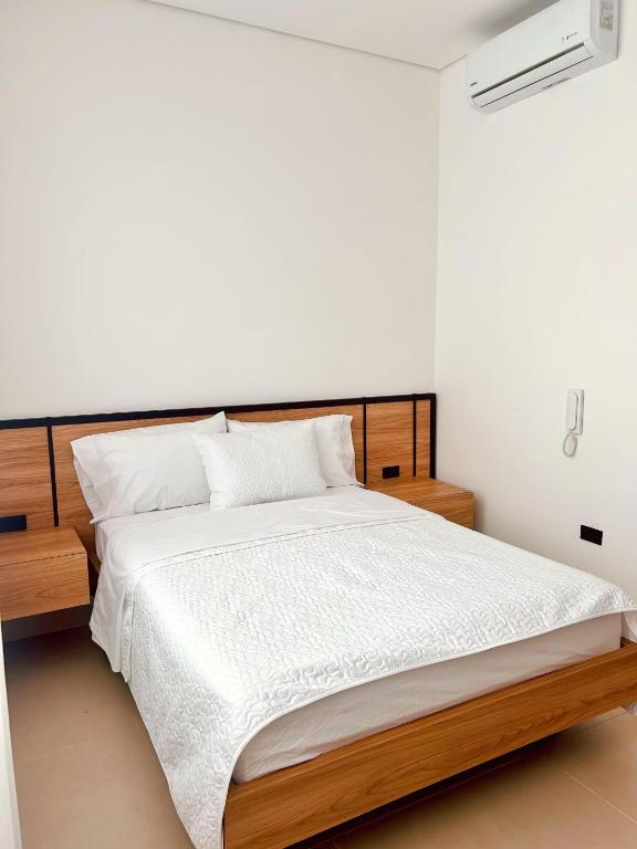 Postel nebo postele na pokoji v ubytování Hotel macana villavicencio