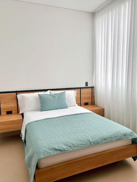 Postel nebo postele na pokoji v ubytování Hotel macana villavicencio