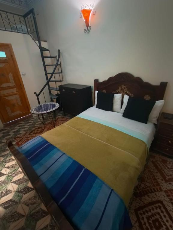 Postel nebo postele na pokoji v ubytování Riad lala Drissia