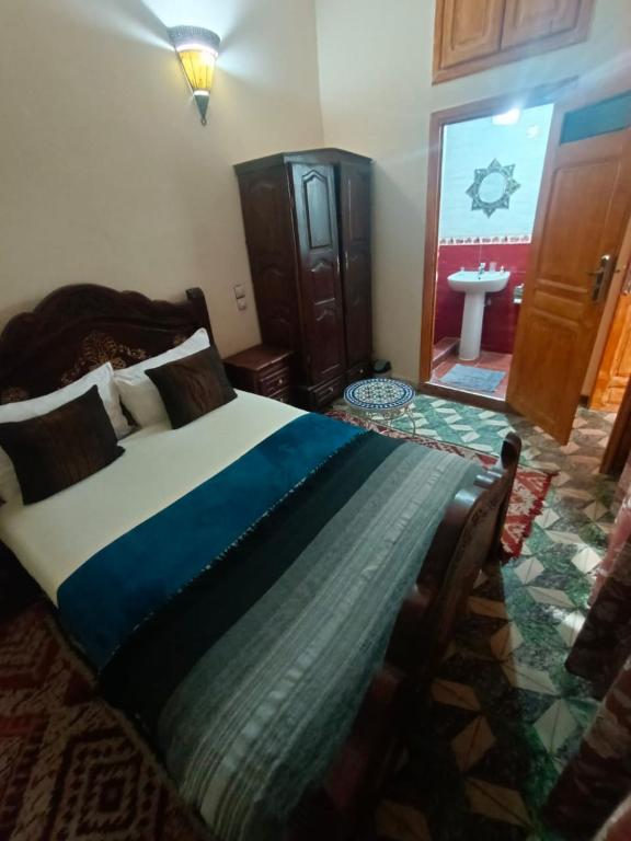 Postel nebo postele na pokoji v ubytování Riad lala Drissia