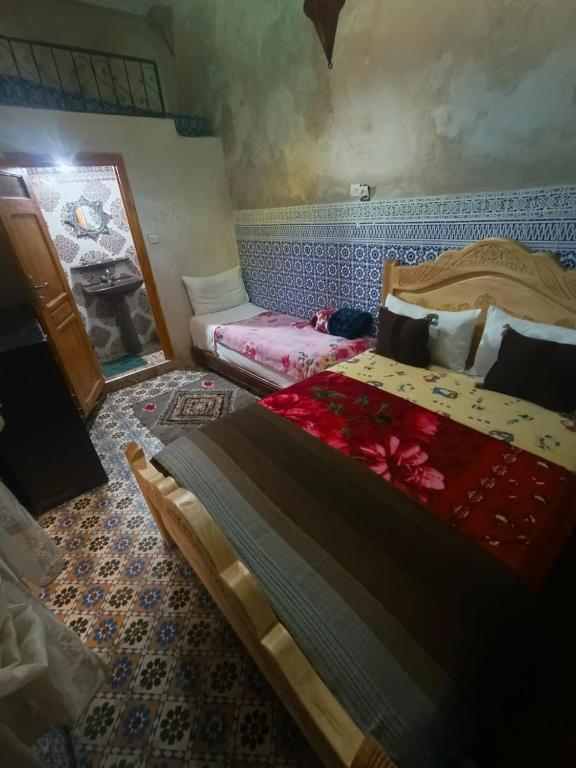 Postel nebo postele na pokoji v ubytování Riad lala Drissia