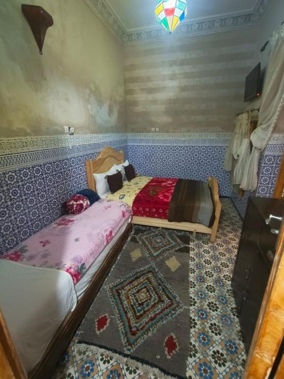 Postel nebo postele na pokoji v ubytování Riad lala Drissia