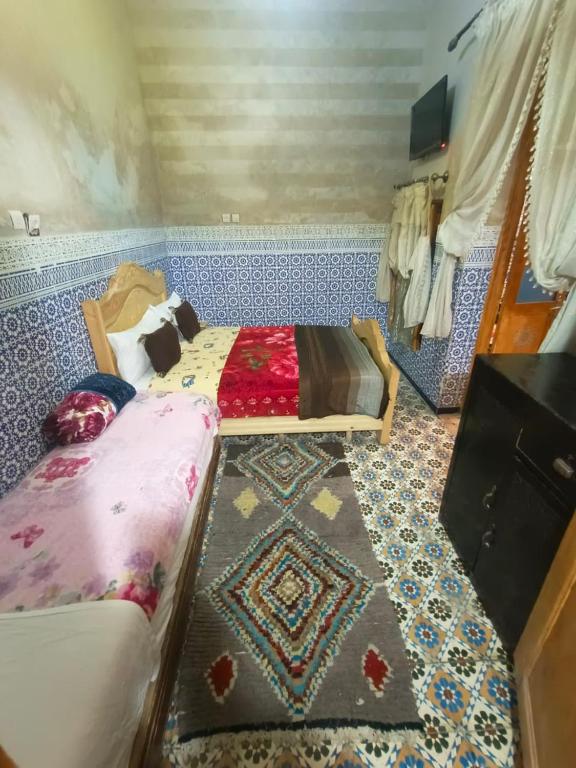 Postel nebo postele na pokoji v ubytování Riad lala Drissia