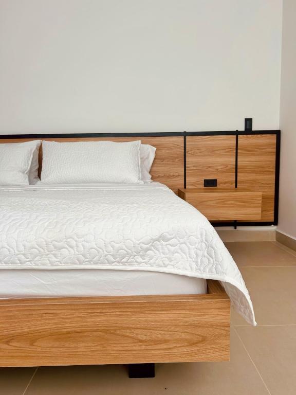 Postel nebo postele na pokoji v ubytování Hotel macana villavicencio