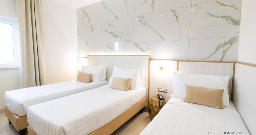 Postel nebo postele na pokoji v ubytování Hotel Windrose