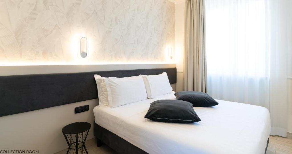 Postel nebo postele na pokoji v ubytování Hotel Windrose