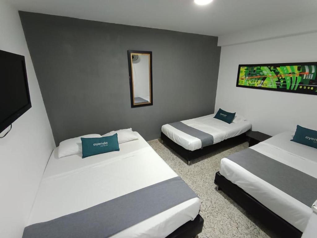 Postel nebo postele na pokoji v ubytování Hotel JC 43