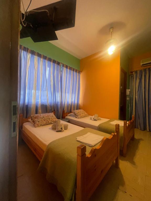 Postel nebo postele na pokoji v ubytování Pislis Rooms