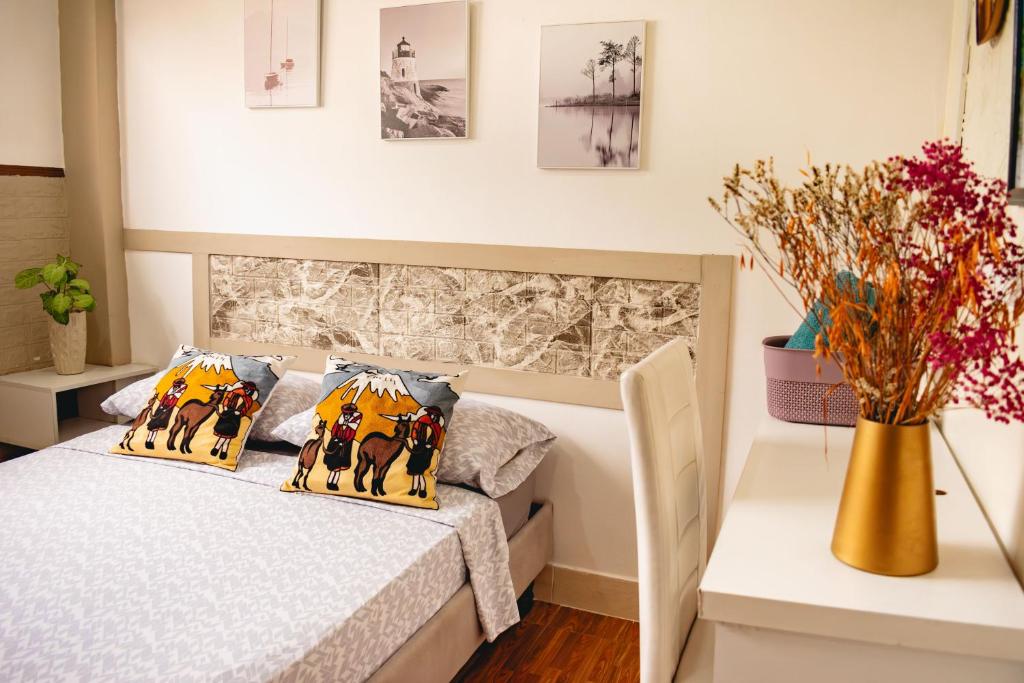 Postel nebo postele na pokoji v ubytování Villa 97 guayaquil Suites y Habitaciones Económicas Cerca del Aeropuerto