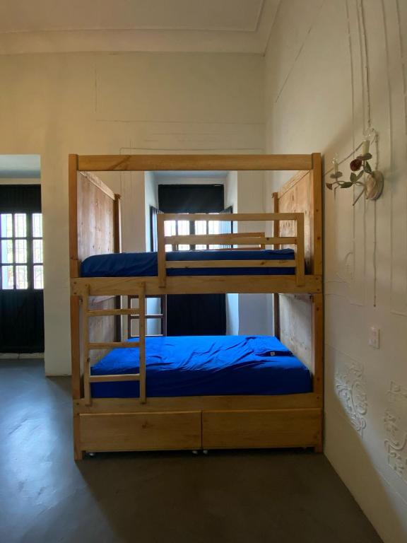 Postel nebo postele na pokoji v ubytování El Pinche Hostal