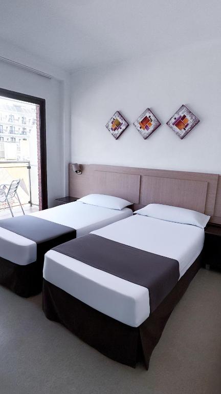 Postel nebo postele na pokoji v ubytování Hotel Primavera