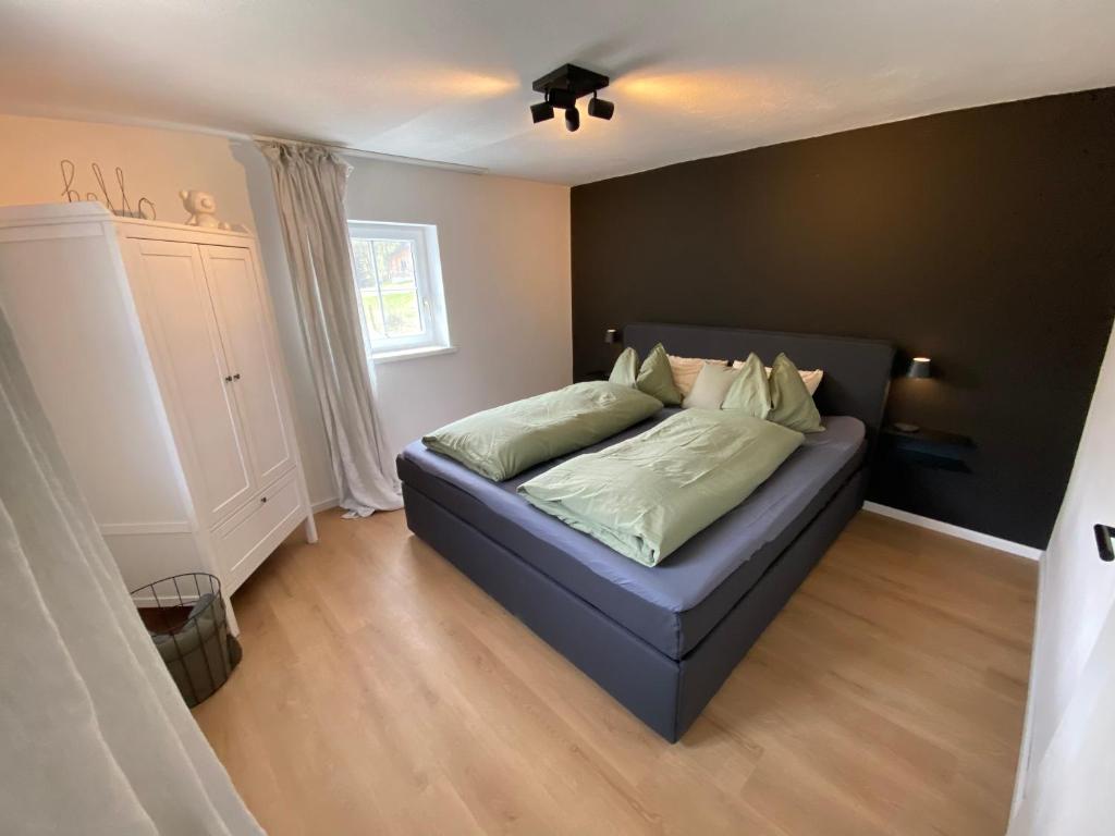 Postel nebo postele na pokoji v ubytování Tini House