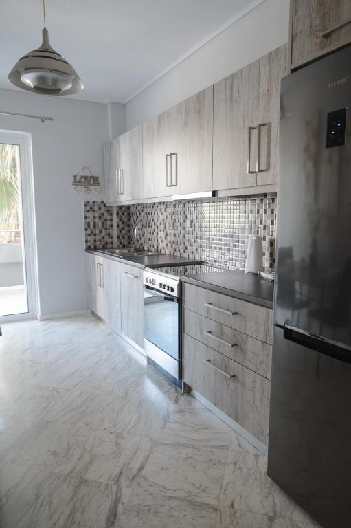 Kuchyň nebo kuchyňský kout v ubytování Sea View Apartment