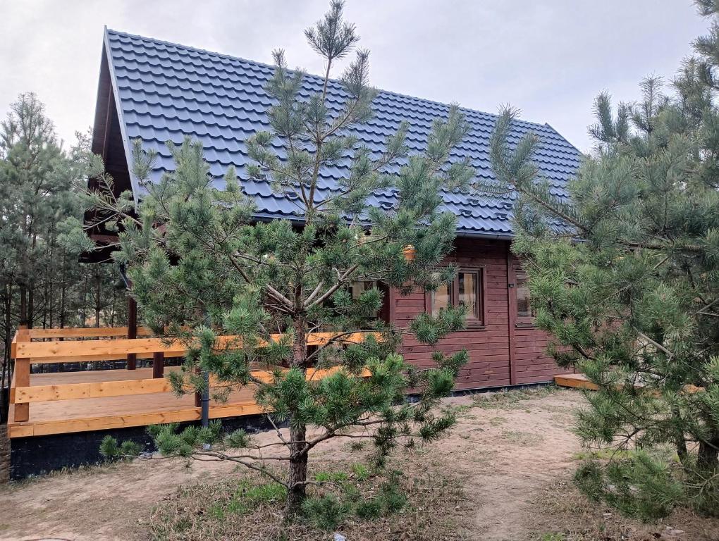 a house with a solar roof on top of it at Osada Blanka Black & White Swornegacie in Swornegacie 