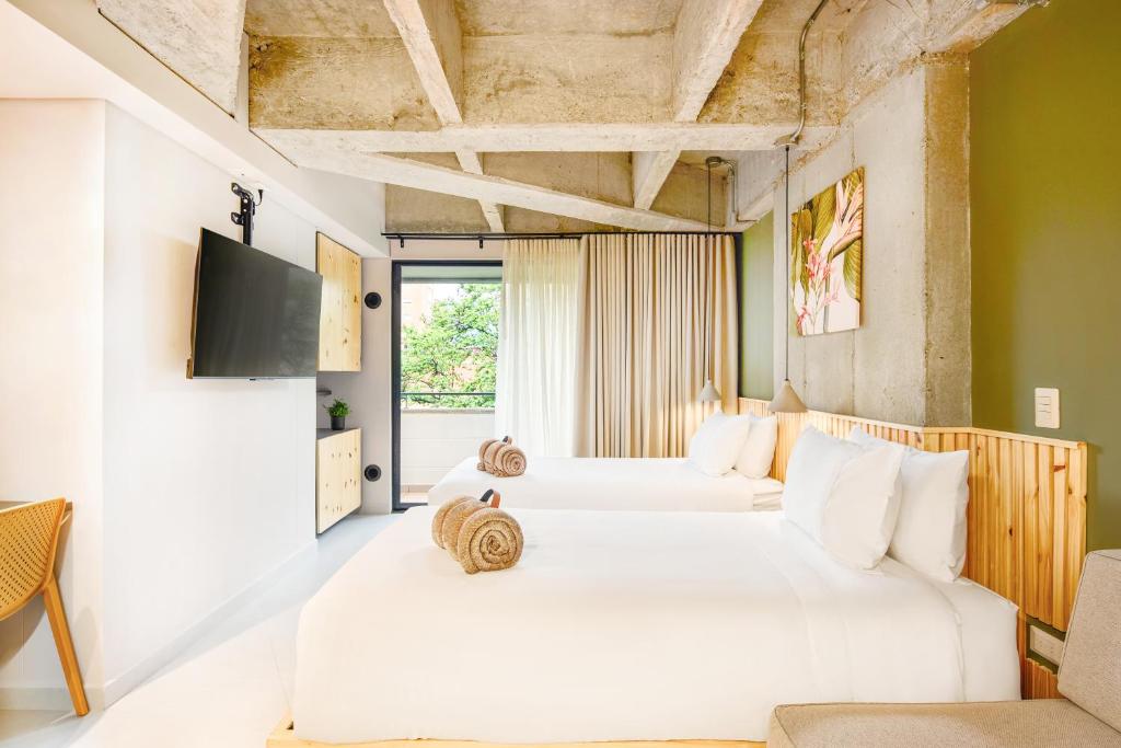 Postel nebo postele na pokoji v ubytování Firenze Lofts