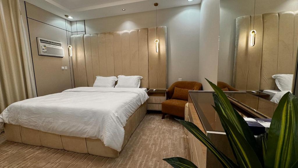 Ένα ή περισσότερα κρεβάτια σε δωμάτιο στο Rkeen Residence 3- bedroom
